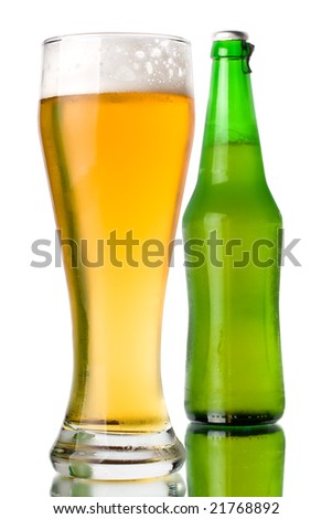Glass and green bottle of beer on a white background