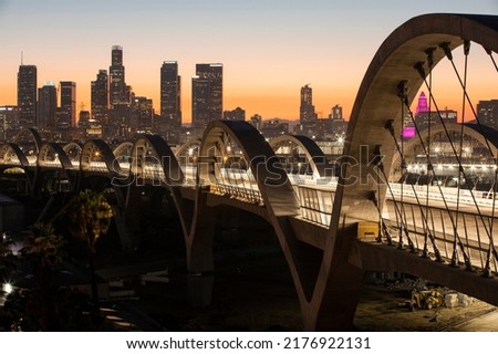 Twilight descends on the 6th Street Bridge as it passes through Downtown Los Angeles, California, USA. Royalty-Free Stock Photo #2176922131