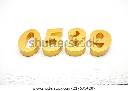  Number 0539 is made of gold painted teak, 1 cm thick, laid on a white painted aerated brick floor, visualized in 3D.                                              