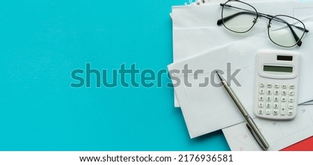 close up top view on group of invoice letter mail from bank on blue background for money and debt management concept Royalty-Free Stock Photo #2176936581