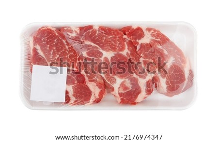 Raw meat in package, isolated on white background