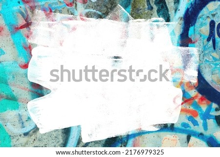 Closeup of colorful teal, gray and red urban wall texture with white white paint stroke. Modern pattern for design. Creative urban city background. Grunge messy street style background with copy space Royalty-Free Stock Photo #2176979325