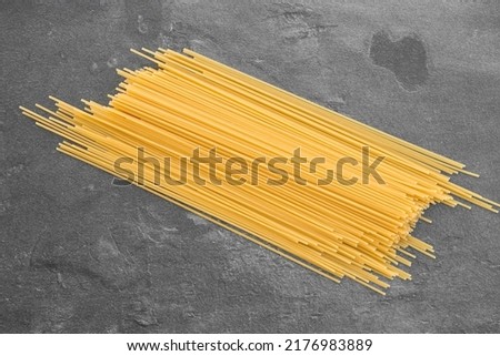 Spaghetti pasta isolated on dark, from above