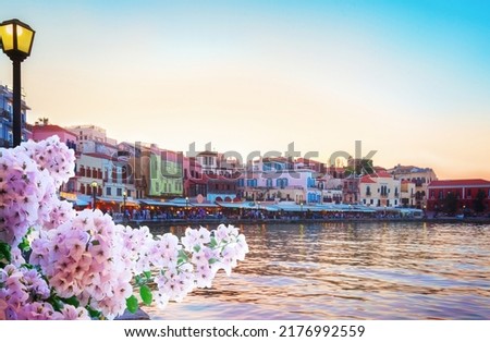 embankment and venetian habour with Turkish Mosque Yiali Tzami of Chania at colorful sunset with flowers, Crete, Greece Royalty-Free Stock Photo #2176992559