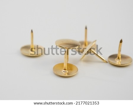 Set of golden thumbtacks. Golden buttons. Royalty-Free Stock Photo #2177021353