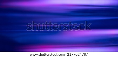 Blur neon glow. Fluorescent banner. Futuristic illumination. Defocused UV navy blue purple pink color light flare motion on modern abstract background. Royalty-Free Stock Photo #2177024787
