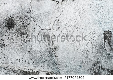Weathered texture. Black dirt stains. Aged concrete wall. Dust grain noise on white weathered uneven abstract free space grunge background. Royalty-Free Stock Photo #2177024809