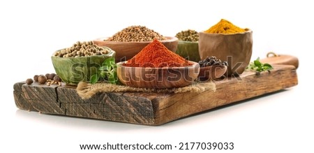 various spices on wooden board isolated on white background Royalty-Free Stock Photo #2177039033