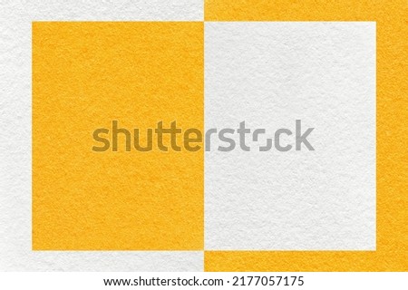 Texture of white and bright yellow paper background with geometric shape and pattern, macro. Structure of craft orange cardboard with frame. Felt abstract backdrop closeup.