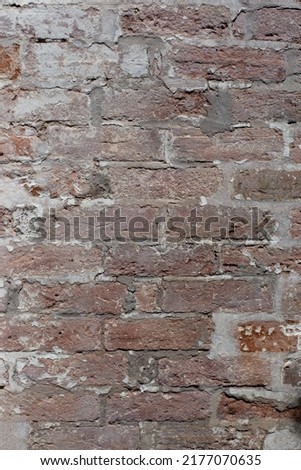 Old brick wall. Aged bricks and cement