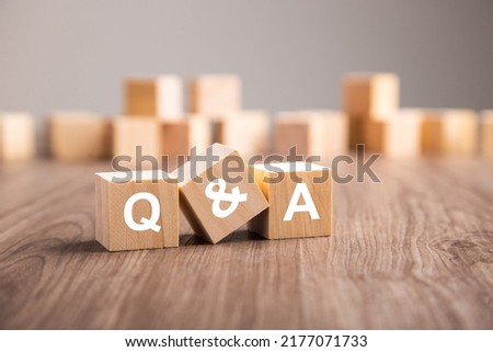 Three wooden cubes with the letters Q and A. questions and answers Q And A concept Royalty-Free Stock Photo #2177071733