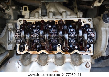 Inspection of the inside of an engine full of sludge Royalty-Free Stock Photo #2177080441