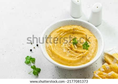 Mashed split pea with herbs and olive oil. Top view, copy space, flat lay. Royalty-Free Stock Photo #2177081373