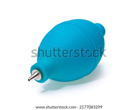 Dust blower for cleaning dust from the camera, lens, electronics. Blue color. Isolated on white background