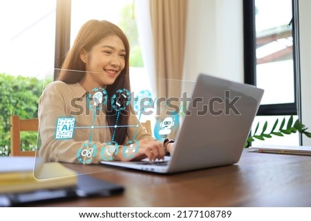 Asian women are using laptops to communicate with business stakeholders via AI and chatbot technologies to help them collect data and analytics for an accurate precision customer in digital marketing. Royalty-Free Stock Photo #2177108789