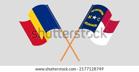 Crossed and waving flags of Romania and The State of North Carolina. Vector illustration
