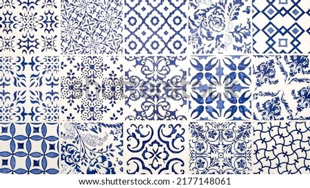 typical blue sicilian or azulejo tin-glazed ceramic floor and wall tilework in different patterns and design