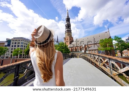 Tourism in Germany. Beautiful young woman visiting the city of Hamburg, Germany. Royalty-Free Stock Photo #2177149631