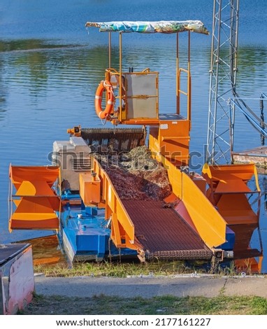 Special Operation Boat for Aquatic Weed Harvesting and Waterway Debris Management at Lake Royalty-Free Stock Photo #2177161227