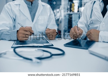 Medicine doctor hand working on a patients x-ray scans digital healthcare and connection with modern virtual screen interface icons, Medical technology and network concept.