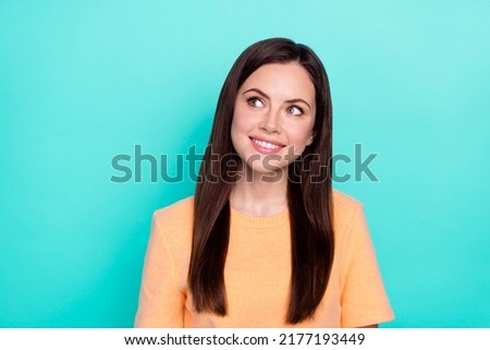 Portrait of gorgeous minded lady toothy smile look empty space isolated on turquoise color background