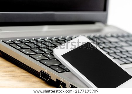 A phone on the keyboard. Keyword Planner is a feature for building strong key word lists.