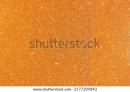 Background with sparkles. Backdrop with glitter. Shiny textured surface. Bright orange. Mixed neon light Royalty-Free Stock Photo #2177209843