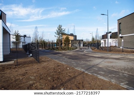 road improvements in a new private neighborhood with designer houses. High quality photo