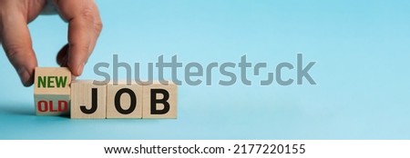 Old Job and New Job, Career change conceptual image. Hand is turning wooden cubes and changes the expression old job to new job. Royalty-Free Stock Photo #2177220155