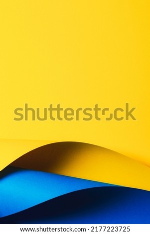 Abstract wave of yellow and light blue paper. Creative geometric curved paper with light and shadows. Abstract geometry background with copy space Royalty-Free Stock Photo #2177223725