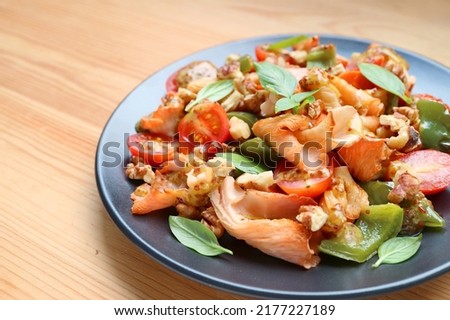Plate of Tasty and Healthy Sauteed Pink Oyster Mushrooms with Colorful Vegetables Royalty-Free Stock Photo #2177227189