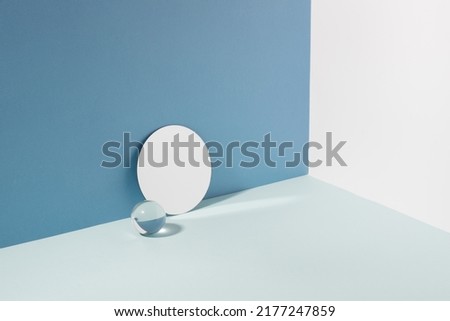 Creative minimalistic podium background various materials, glass mirror, blue hard shadow background