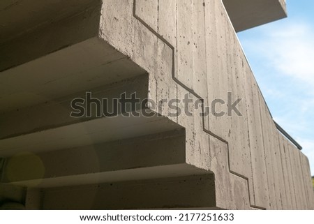 architecture: staircase with particular external fire ramp to a modern building, in reinforced concrete and granite floor, consistent with the building. Royalty-Free Stock Photo #2177251633