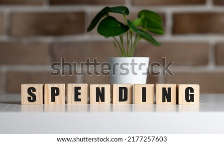 Spending word, symbol. Business spend or make money concept. Copy space