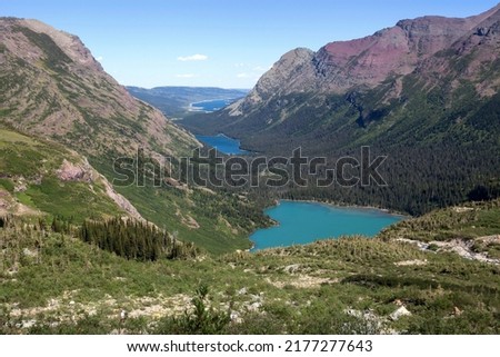 Mountain landscape at Grinnell Glacier Trail with View of Grinnell Lake, Lake Josephine and Lake Sherburne, Many Glacier area, Glacier National Park, Rocky Mountains, Montana, USA Royalty-Free Stock Photo #2177277643