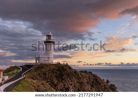 a wide shot at sunrise of the historic lighthouse at cape byron at byron bay in northern nsw, australia Royalty-Free Stock Photo #2177291947