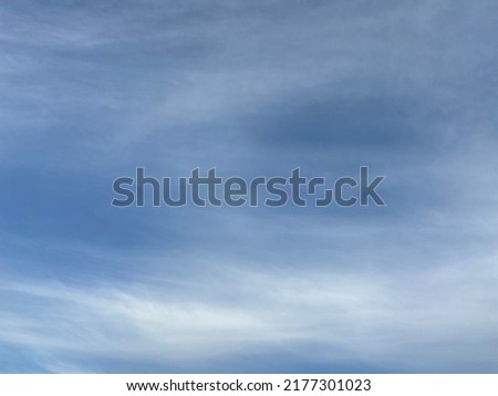 Real White Feathery Cirrus Clouds In Blue Sky 