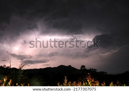 Composite image of a lightning bolt between storm clouds. Multiple images were used and combined in post processing to create multiple lightning bolts in one picture.