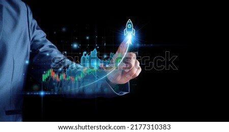 Businessman planning to invest in stock market. man touching success goals icon on virtual screen, stock graph is rising, economy is recovering, stock trading, bussiness start up, business success.
