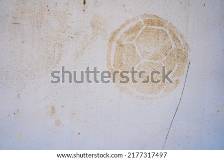 Football print on cement background,soccer slough on wall