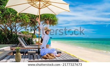 Happy traveler woman relaxing under umbrella joy fun nature view scenic landscape beach, Leisure time tourist travel Phuket Thailand summer holiday vacation, Tourism beautiful destination place Asia Royalty-Free Stock Photo #2177327673