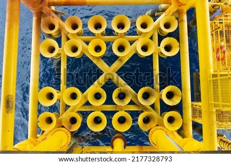 Pipes and tubes for production in offshore oil and gas rig structures that produce crude gas and crude oil from sub-surface to surface. Royalty-Free Stock Photo #2177328793