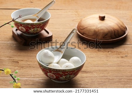 Glue Pudding or Tangyuan in Bowl.Chinese Lantern Festival Food. On Wooden Table  Royalty-Free Stock Photo #2177331451