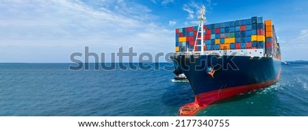 In Front View of large cargo ship import export container box on the ocean sea on blue sky back ground concept transportation logistic and service to customer and supply change  forwarder mast