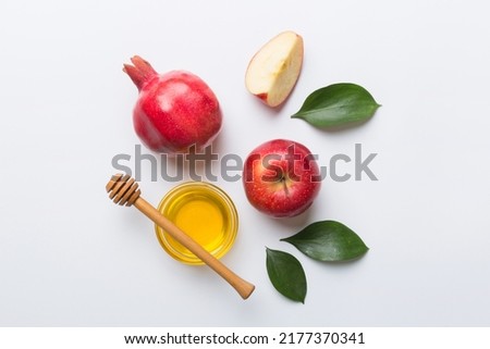 Flat lay composition with symbols jewish Rosh Hashanah holiday attributes on colored background, Rosh hashanah concept. New Year holiday Traditional. Top view with copy space. Royalty-Free Stock Photo #2177370341