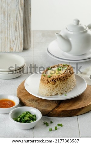 Authentic steamed rice with chicken gravy and egg