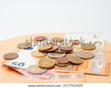 Euro bills and coins. Cash. The concept of savings.