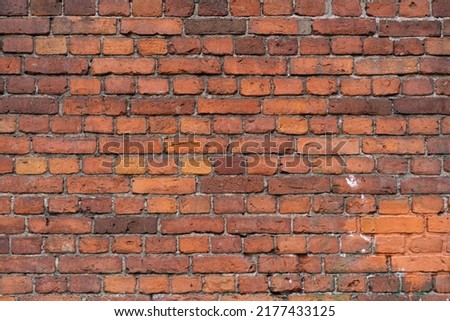 Empty brick red wall. background of a brick house.