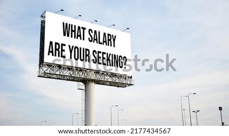 What salary are your seeking? text message on signboard with blue sky