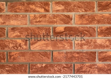 Old brick wall. Rustic old brickwork. The structure and pattern of a destroyed stone wall. Copy space